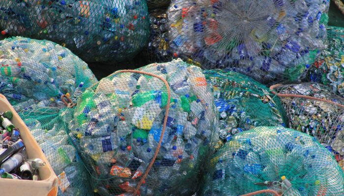Plastic bottles bagged up for recycling - Brown Recycling