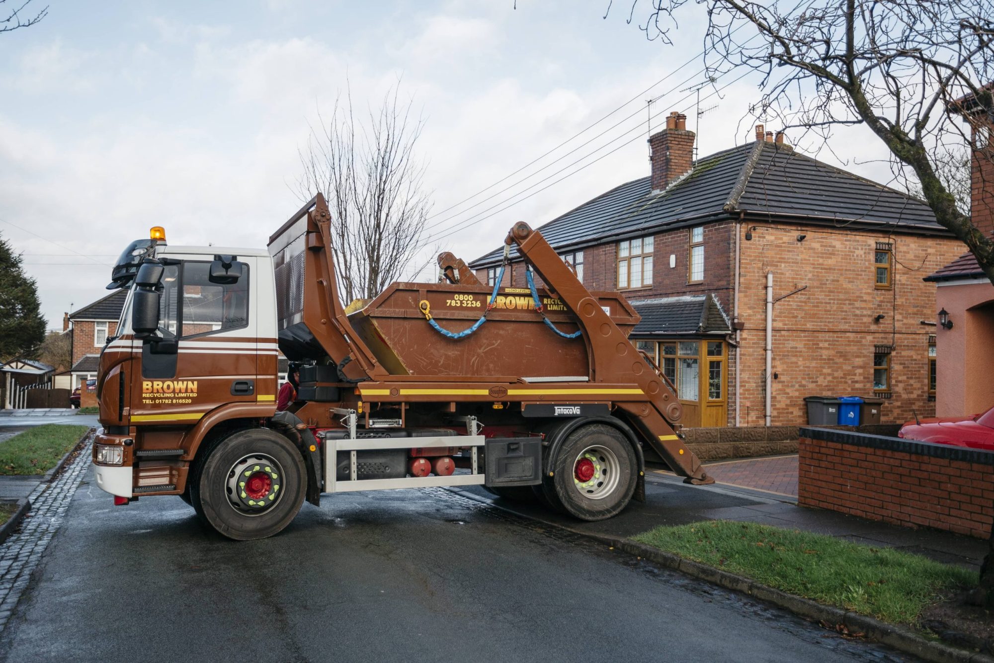 Brown Recycling truck midi skip hire delivery