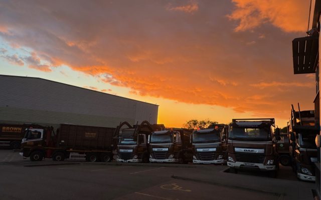 sunset over the Brown recycling truck yard