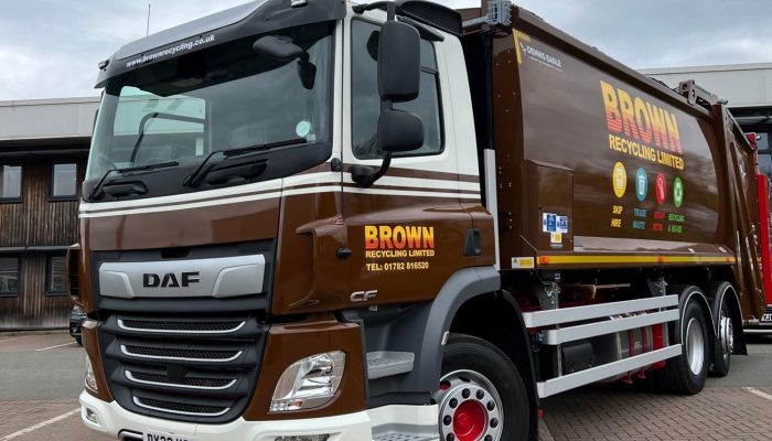 Brown recycling bin collection truck