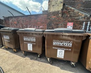 tigerbite trade bins in front of a brick wall - Brown recycling