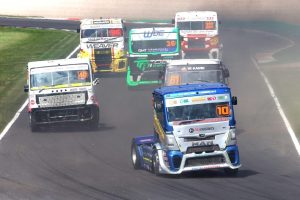 Brown recycling truck racing on a track