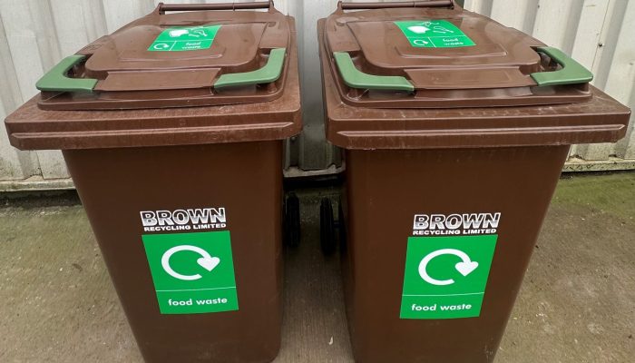 brown food waste bins with green labels - Brown recycling