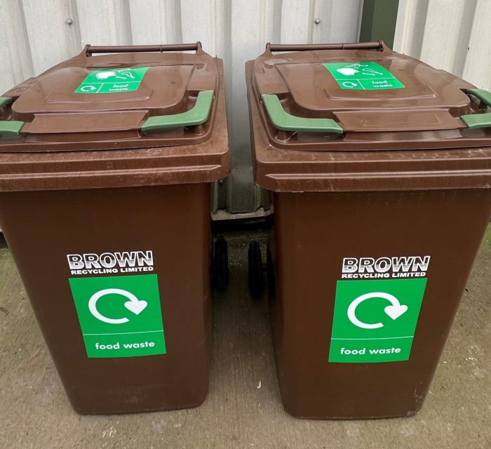 brown food waste bins with green labels - Brown recycling